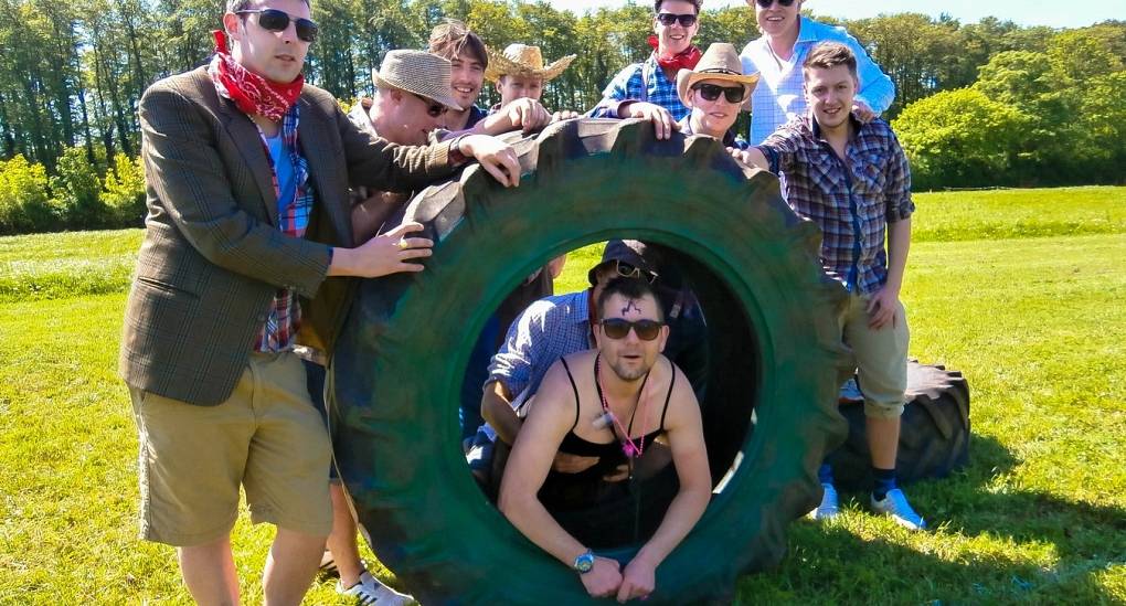 A group of stags pose for a West Country Games picture