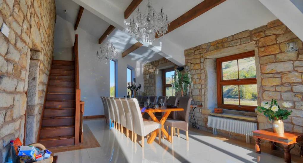 Hallway and large dining table set up for guests