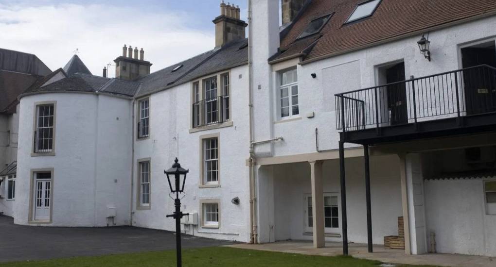 Luxury Edinburgh hen party accommodation at Lux Life, featuring Victorian period features, four-poster beds, and open-plan living areas for large groups.