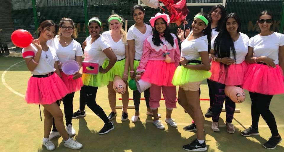 Hen group take a group picture after playing the Olympic Shames