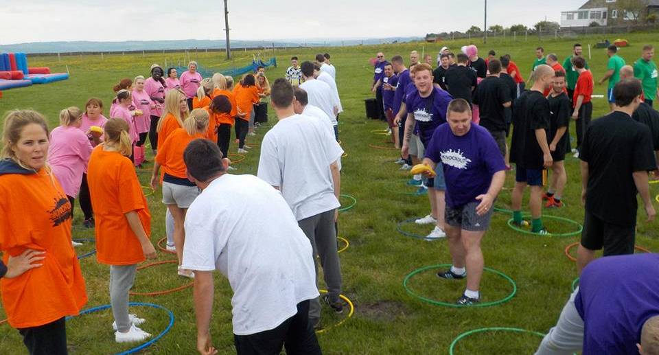 Teams compete to be the top of the leaderboard. Inflatable games
