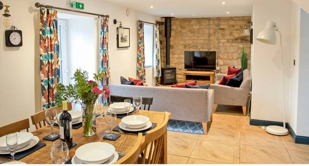 Open-plan kitchen, dining, and lounge area at Lathkill Escape, the perfect social space for a Peak District hen do.