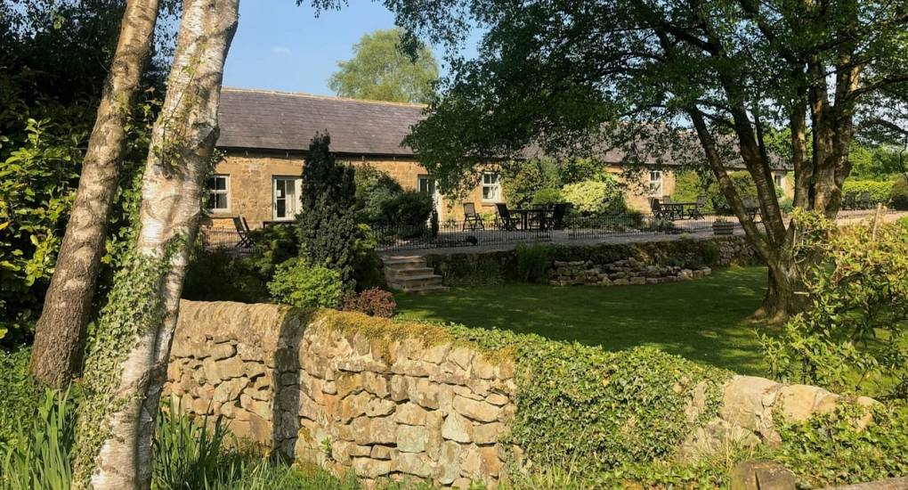 Large private garden and terrace area at Lathkill Escape luxury hen party cottages in the Peak District.