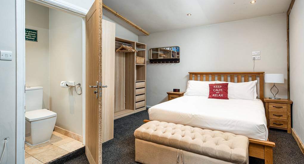 Bedroom and ensuite at the Acres party house near Bath and Bristol
