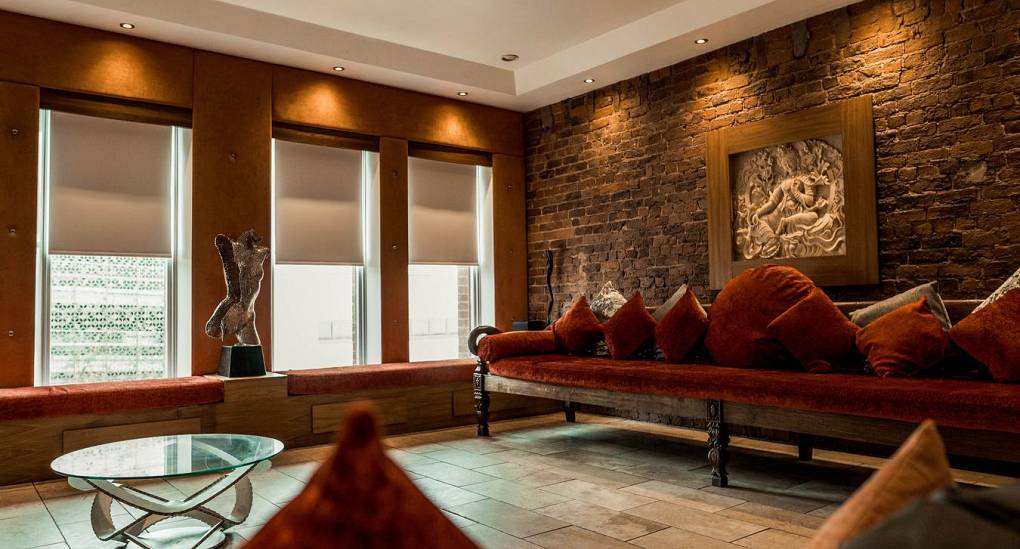 Stag and Hen Accommodation lounge with exposed brick wall