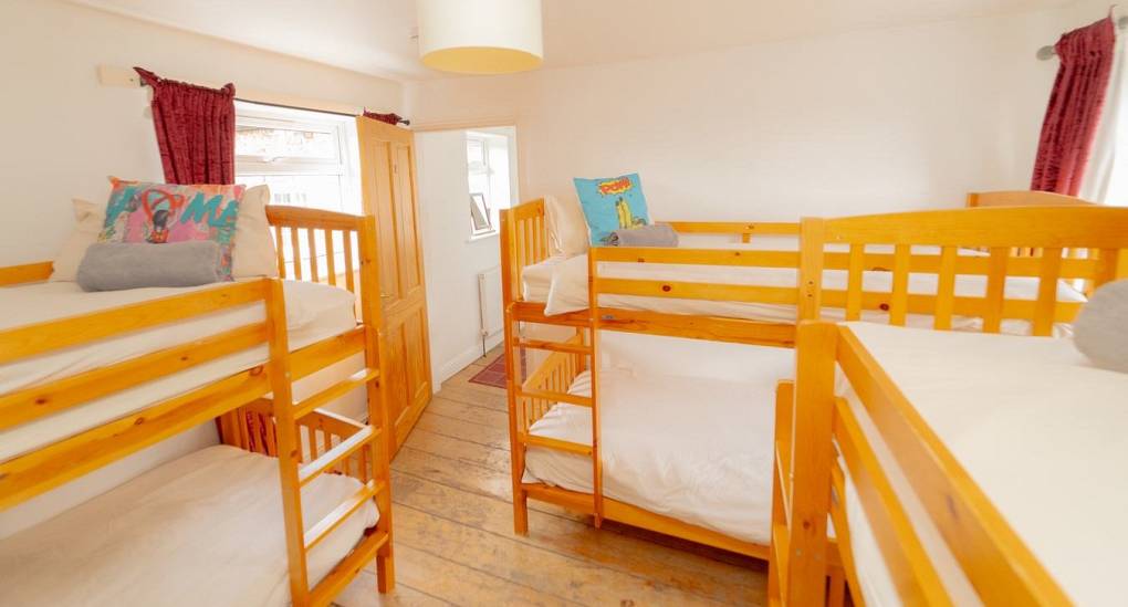 three bunk beds in bedroom