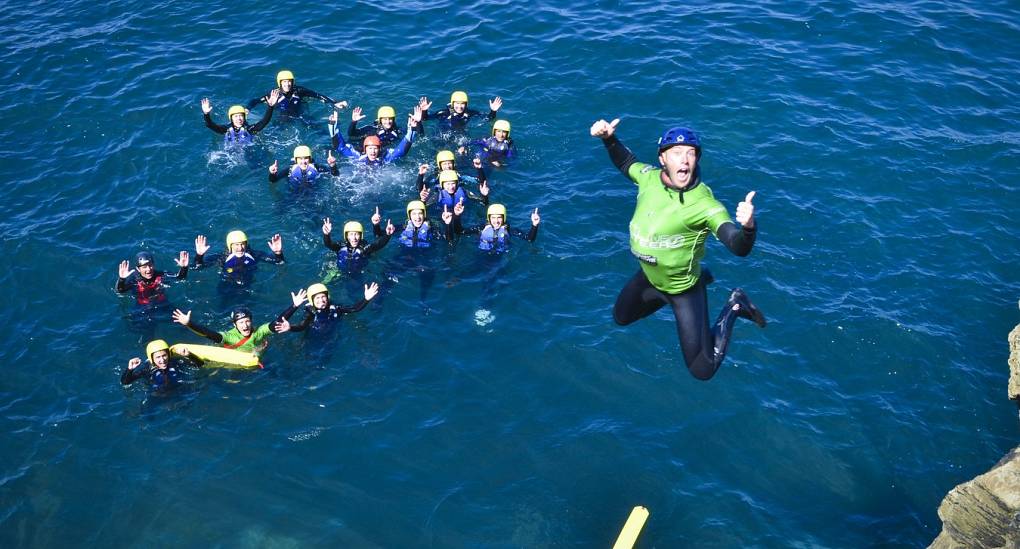 Coasteering stag posing for action shot