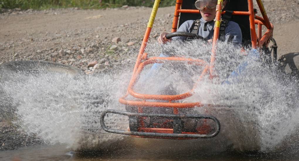Stag taking on a particularly wet obstacle in a Rage Buggy