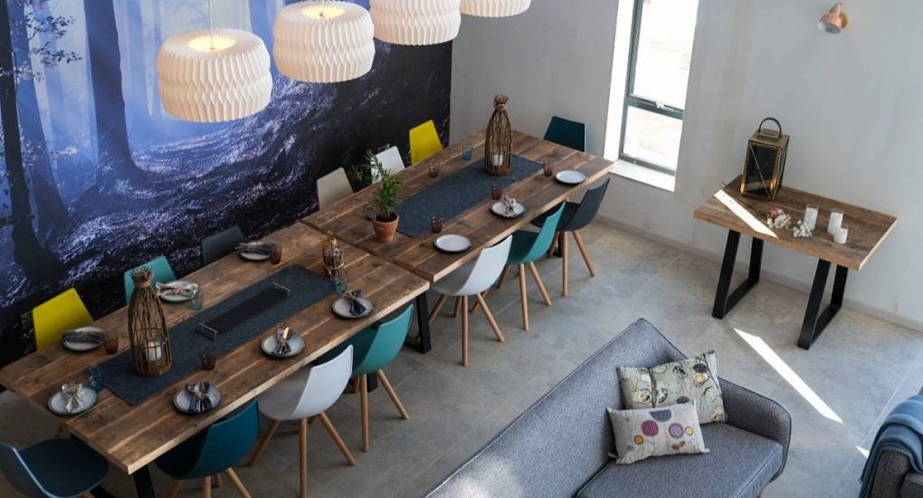 Long dining table at Tree View: Open-plan Hen Party House seating for up to 16 guests