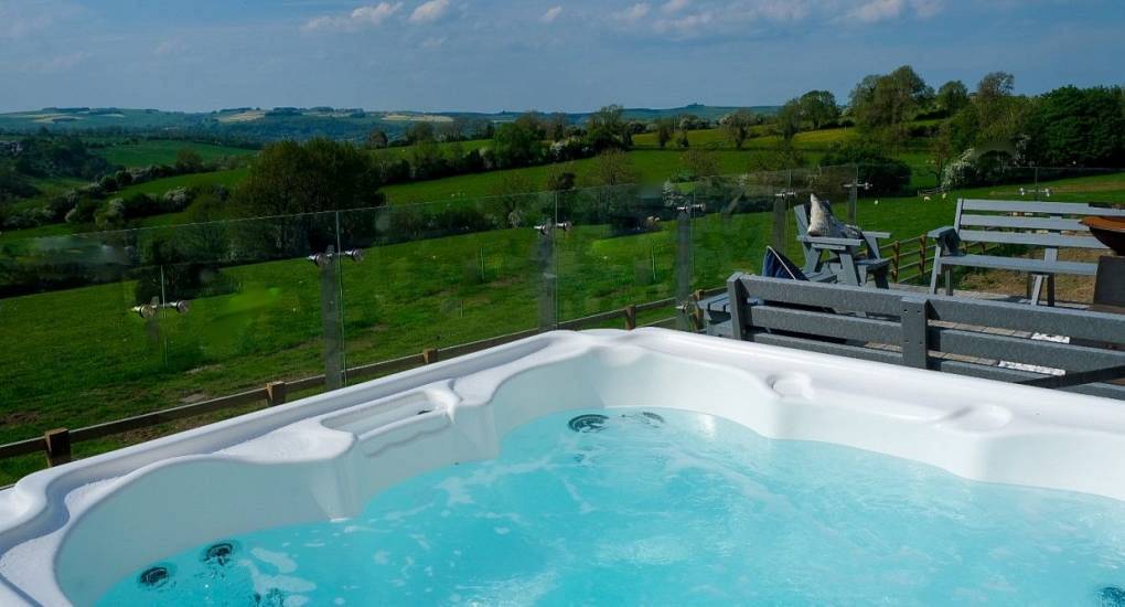 Lovely view of the hot tub and hills: Tree View Hen Party House jacuzzi  