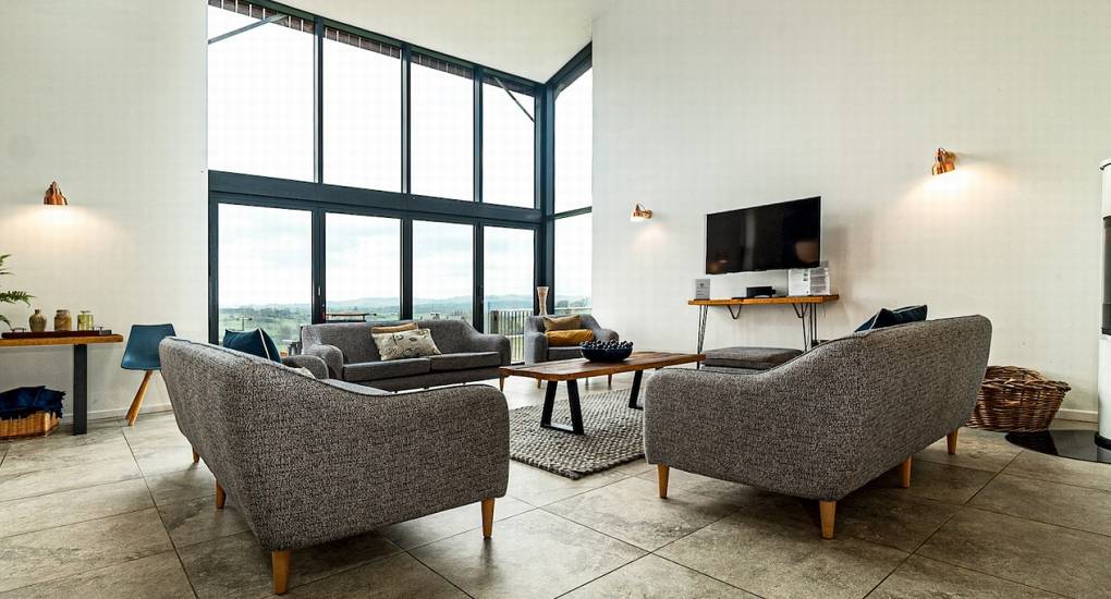 Open plan living room and seating area at Tree View Hen Party House (Sleeps 16)